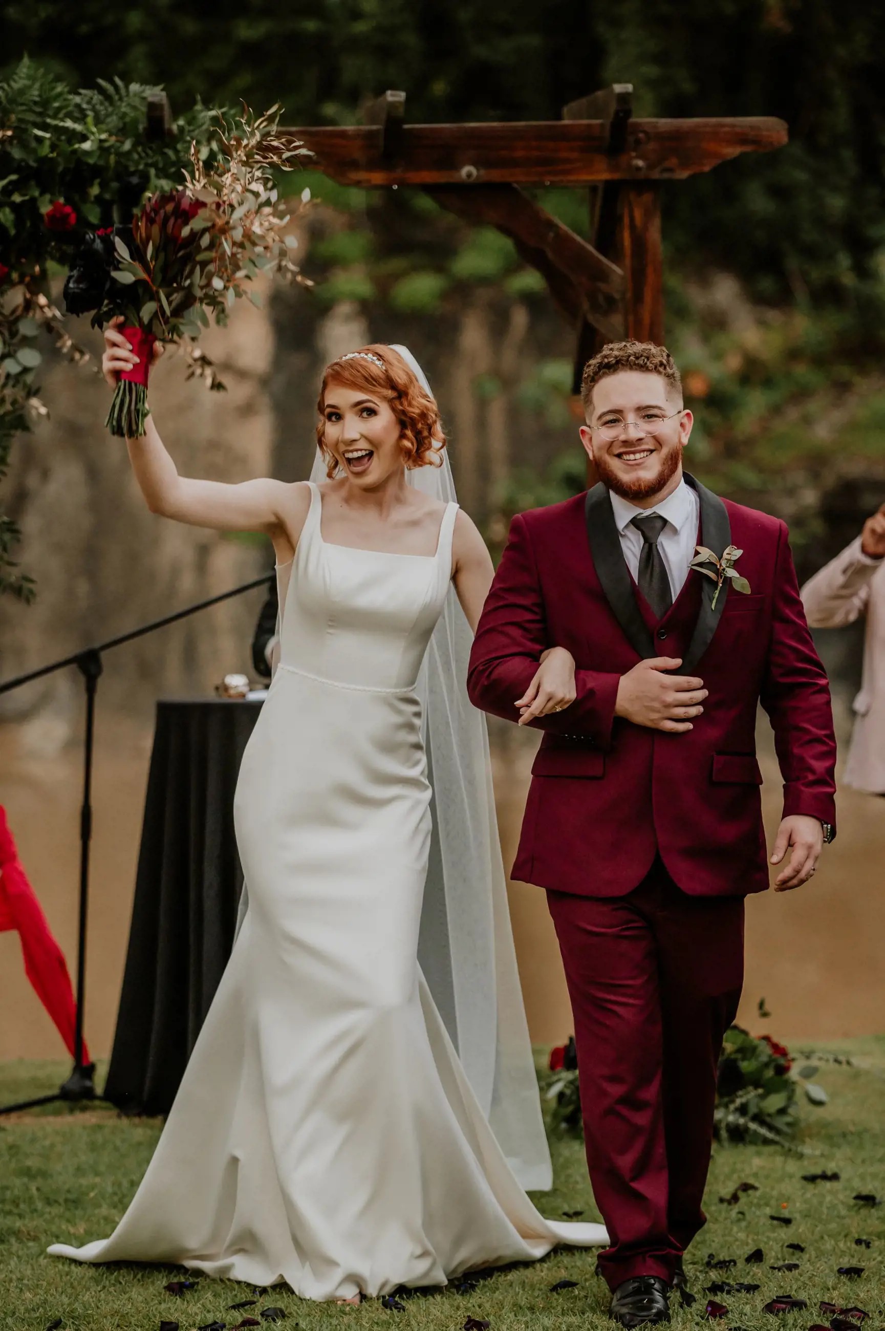 Сouple wearing a white gown and a black suit